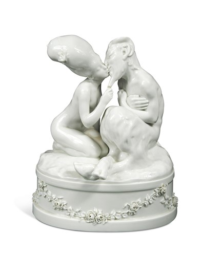 Lot 641 - A Royal Copenhagen blanc de chine figure group of a Faun and Nymph