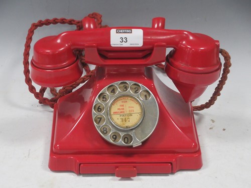 Lot 33 - Vintage red bakelite case telephone with...