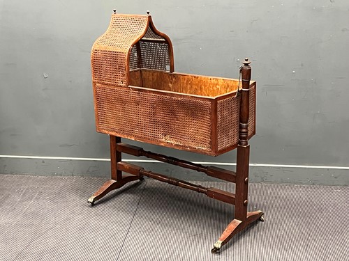 Lot 691 - A Regency mahogany caned rocking cradle on...
