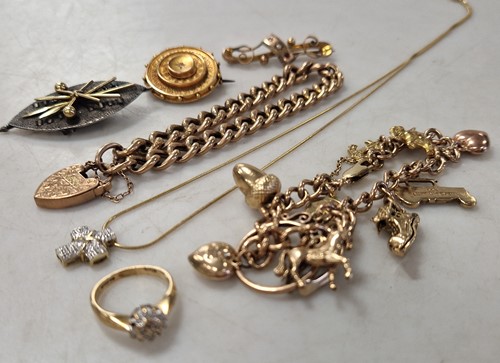 Lot 342 - A 9ct charm bracelet with charms, a 9ct curb...