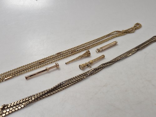 Lot 348 - Two guard chains, both tested as 9ct gold,...