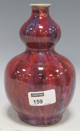 Lot 159 - A Chinese flambe glaze double gourd vase, 19cm...