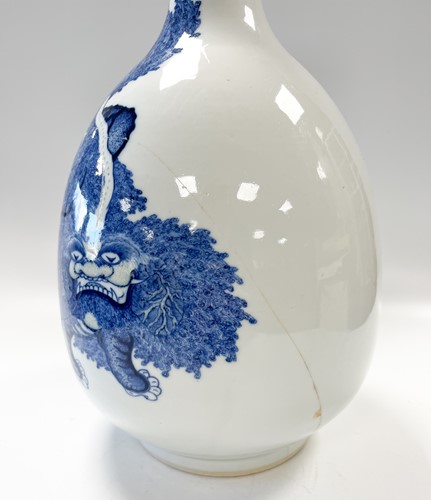 Lot 16 - A Chinese blue and copper-red porcelain Buddhist Lion bottle vase, Qing Dynasty, Kangxi Emperor circa 1700