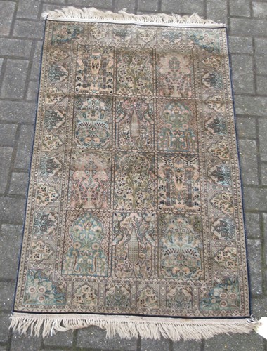 Lot 839 - A silk Turkish Hereke rug with a blue and...