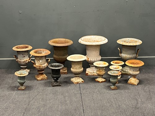 Lot 813 - A group of Victorian cast iron garden urns of...