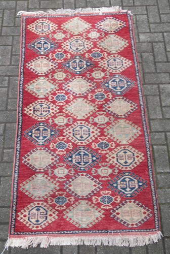 Lot 836 - A Caucasian design rug 195 x 92 cm