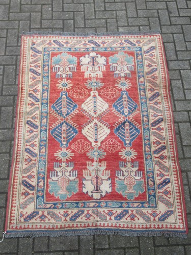 Lot 838 - A Caucasian Kazak style rug with a orange...