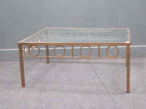 Lot 814 - A modern brass framed coffee table with glass...