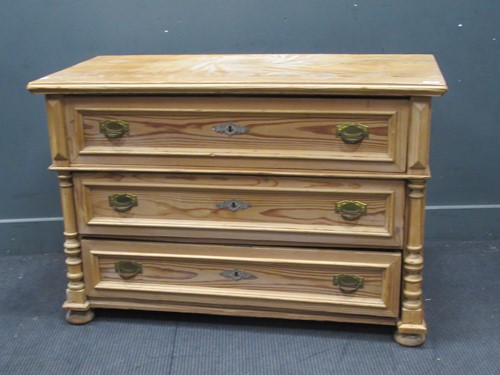 Lot 853 - A modern pine chest of three long drawers...
