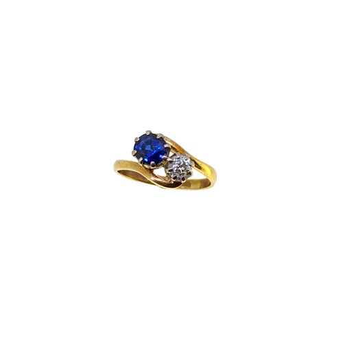 Lot 242 - An 18ct gold sapphire and diamond ring