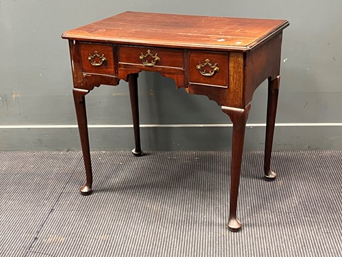 Lot 573 - A George II mahogany side table, fitted with...