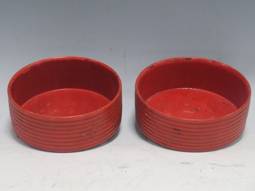 Lot 31 - A pair of ribbed red lacquer coasters (2)