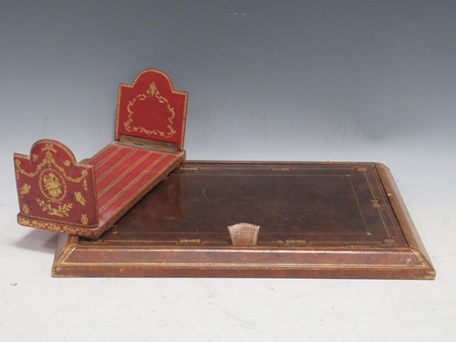 Lot 28 - An embossed leather desk blotter; book stand:...