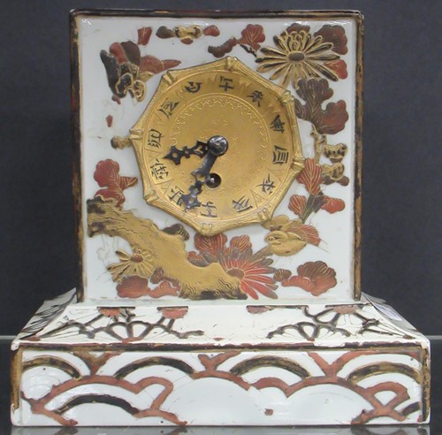 Lot 43 - A Japanese pottery mantle clock 19cm high and...