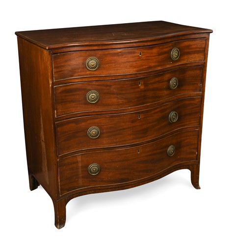 Lot 585 - A George III mahogany serpentine chest, circa 1790