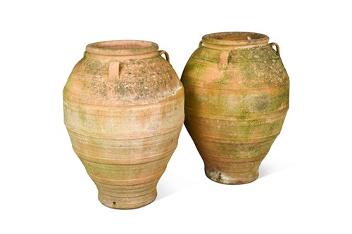 Lot 769 - A pair of large terracotta oil jars, 20th century