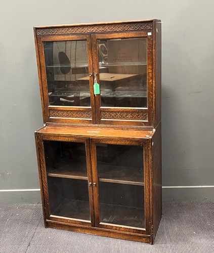Lot 425 - An oak two section glazed door bookcase circa...