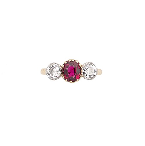 Lot 286 - An 18ct gold Burmese ruby and diamond three stone ring