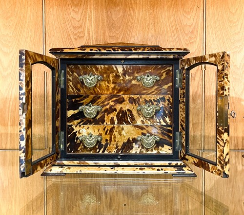 Lot 544 - A tortoiseshell table cabinet, 19th century