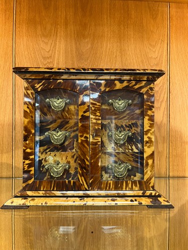 Lot 544 - A tortoiseshell table cabinet, 19th century