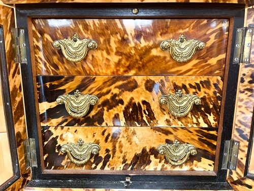 Lot 544 - A tortoiseshell table cabinet, 19th century