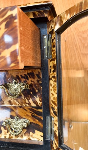 Lot 544 - A tortoiseshell table cabinet, 19th century