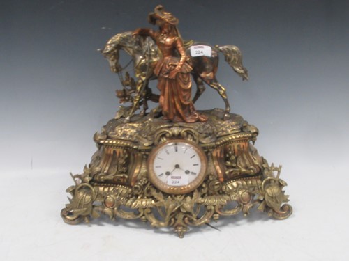 Lot 224 - A French patinated brass mantle clock