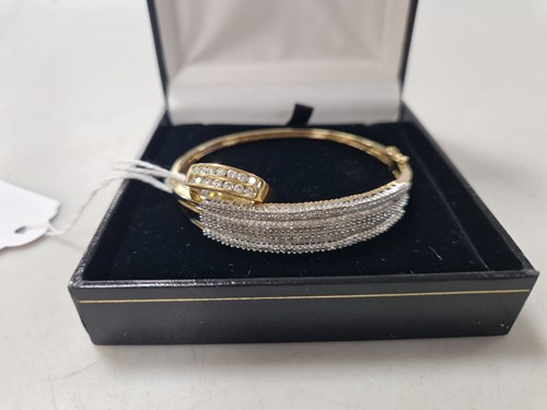 Lot 361 - A hallmarked 18ct gold double row diamond ring...