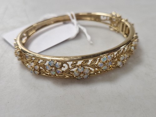 Lot 363 - An opal and diamond bangle, hallmarked...
