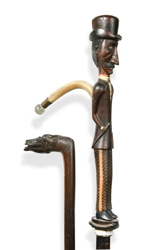 Lot 661 - A Colonial hardwood walking stick with curving horn handle, early 20th century