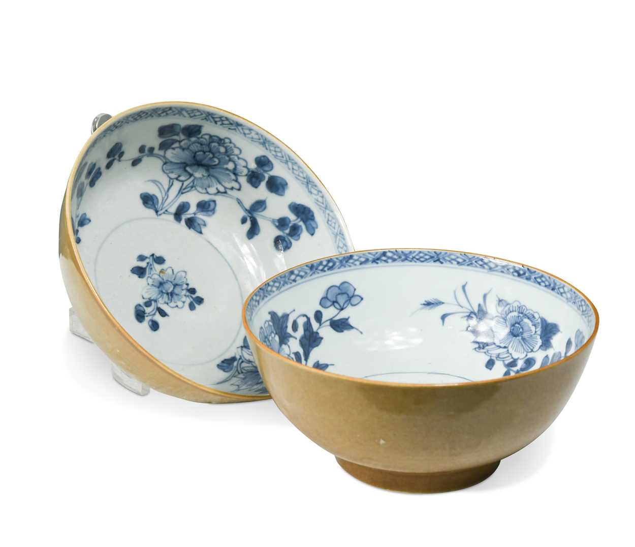 Lot 13 - Two Chinese Nanking Cargo blue and white and cafe-au-lait bowls, circa 1750