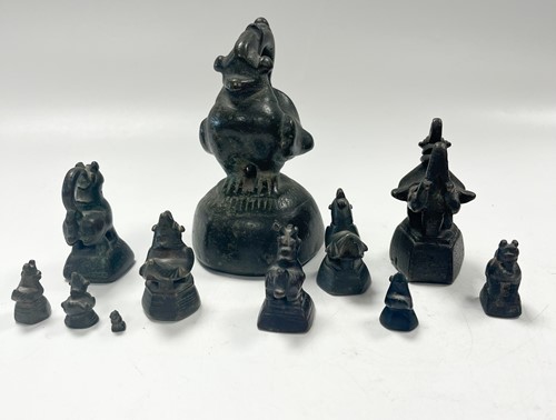 Lot 97 - A set of eleven Burmese bronze 'opium' weights, 19th century