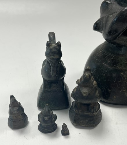 Lot 97 - A set of eleven Burmese bronze 'opium' weights, 19th century