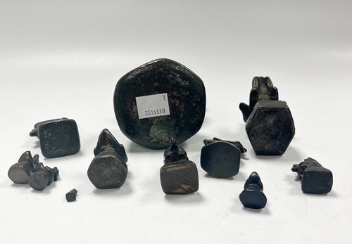 Lot 97 - A set of eleven Burmese bronze 'opium' weights, 19th century