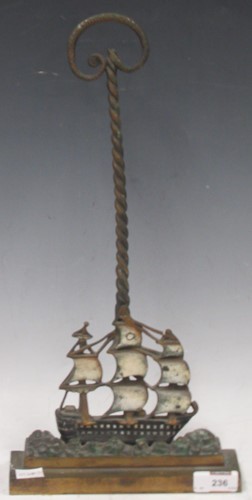 Lot 236 - A painted cast metal door stop modelled as a...