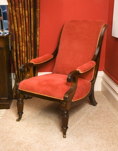 Lot 563 - A Regency mahogany frame scroll arm easy chair