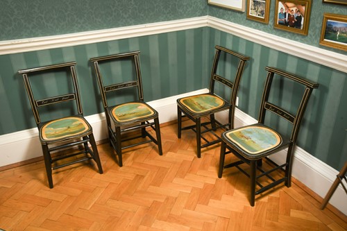 Lot 586 - A set of four 'East Kent Hunt' ebonised frame side chairs