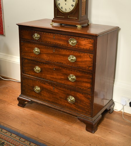 Lot 567 - A George III mahogany chest of four long drawers