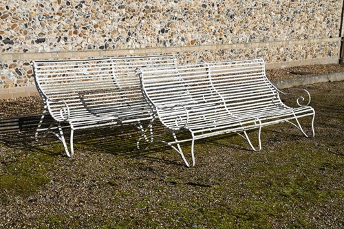 Lot 774 - A near pair of white painted iron garden benches