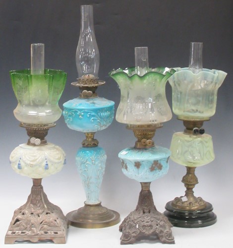 Lot 123 - Four Victorian glass and metal oil lamps with...