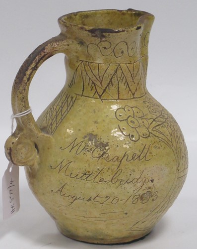 Lot 40 - A 19th century saltglazed jug, the body...