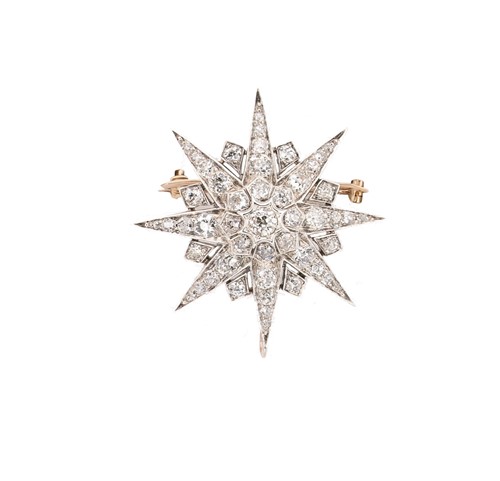 Lot 260 - A diamond set star brooch