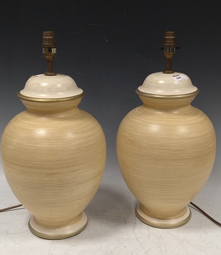 Lot 549 - A pair of cream and gold painted china...