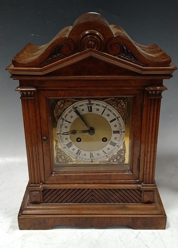Lot 246 - An Edwardian walnut table clock
