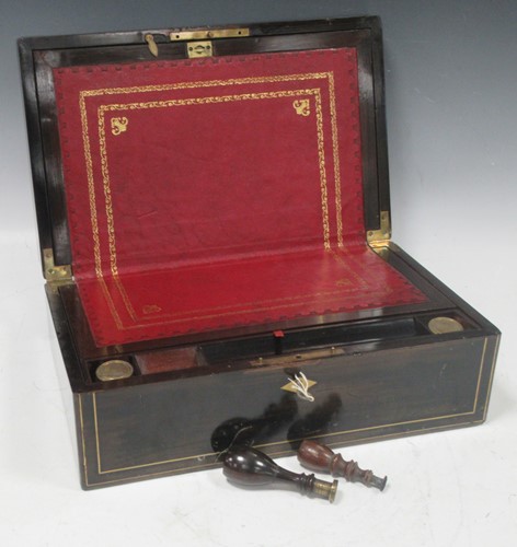 Lot 128 - A Victorian ebonised and brass inlaid writing...