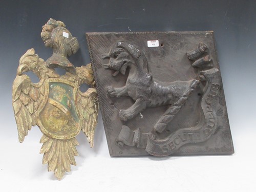 Lot 48 - A wooden painted and carved coat of arms of...