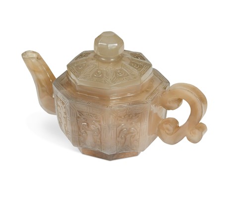 Lot 67 - A Chinese carved solid agate teapot and cover, late Qing Dynasty, circa 1890