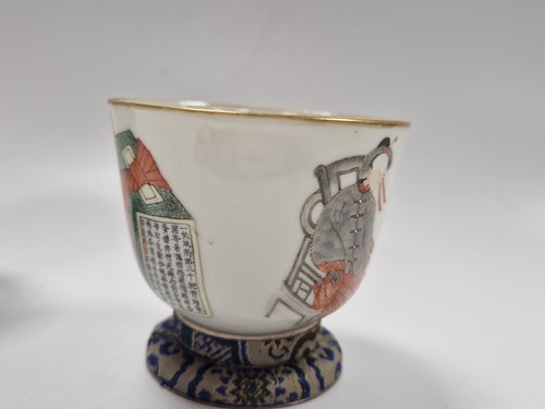 Lot 31 - A set of three Wu Shuang Pu famille rose bowls, late Qing Dynasty