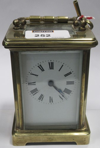 Lot 252 - A brass carriage clock with Roman chapter ring...