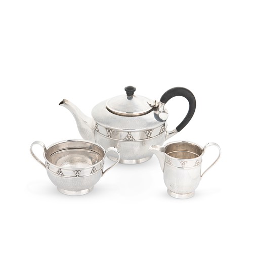 Lot 648 - A George V silver Arts & Crafts style 3-piece tea set